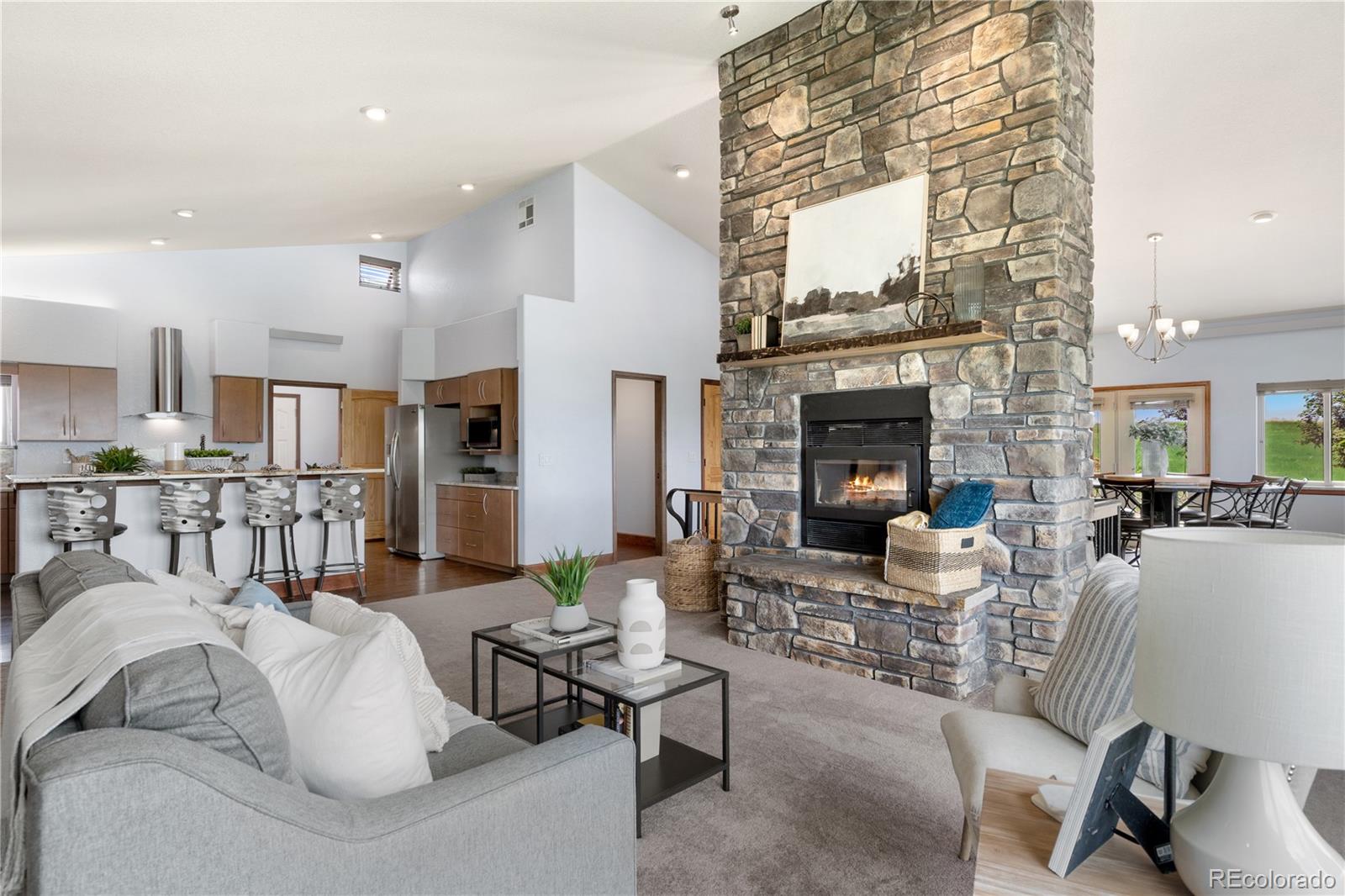 17622 County Road 1 Berthoud, CO 80513 - Photo 16 of 37 a living room with furniture and a fireplace