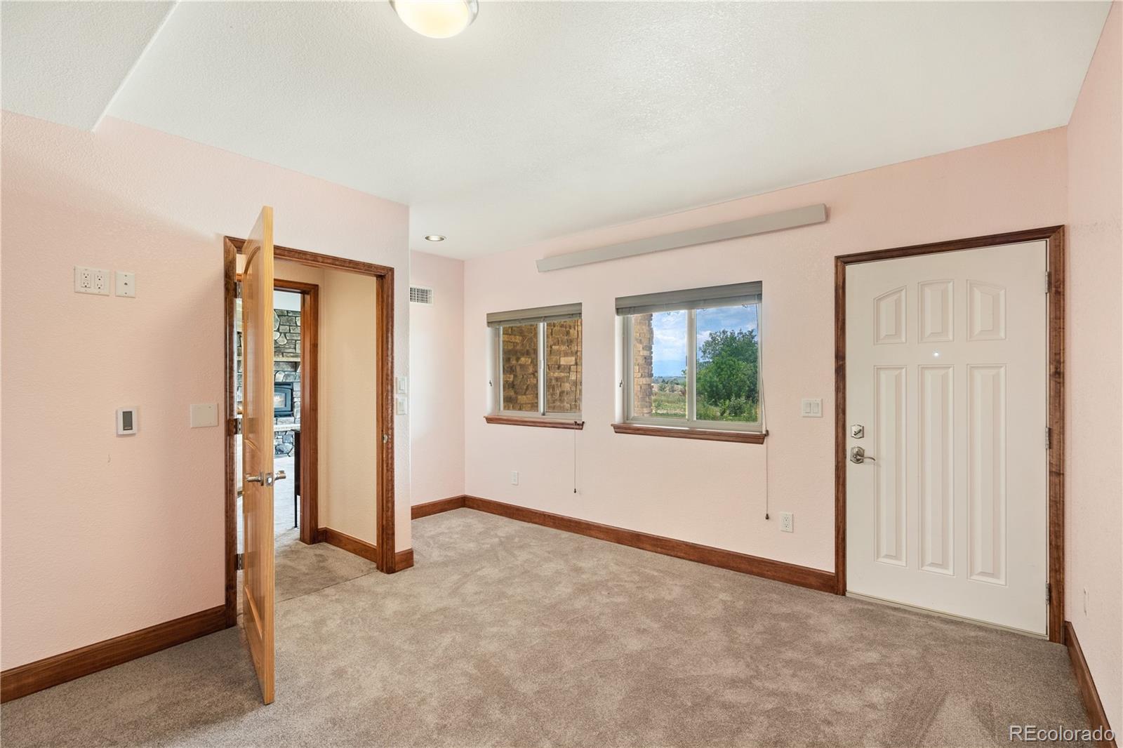 17622 County Road 1 Berthoud, CO 80513 - Photo 32 of 37 an empty room with windows and closet