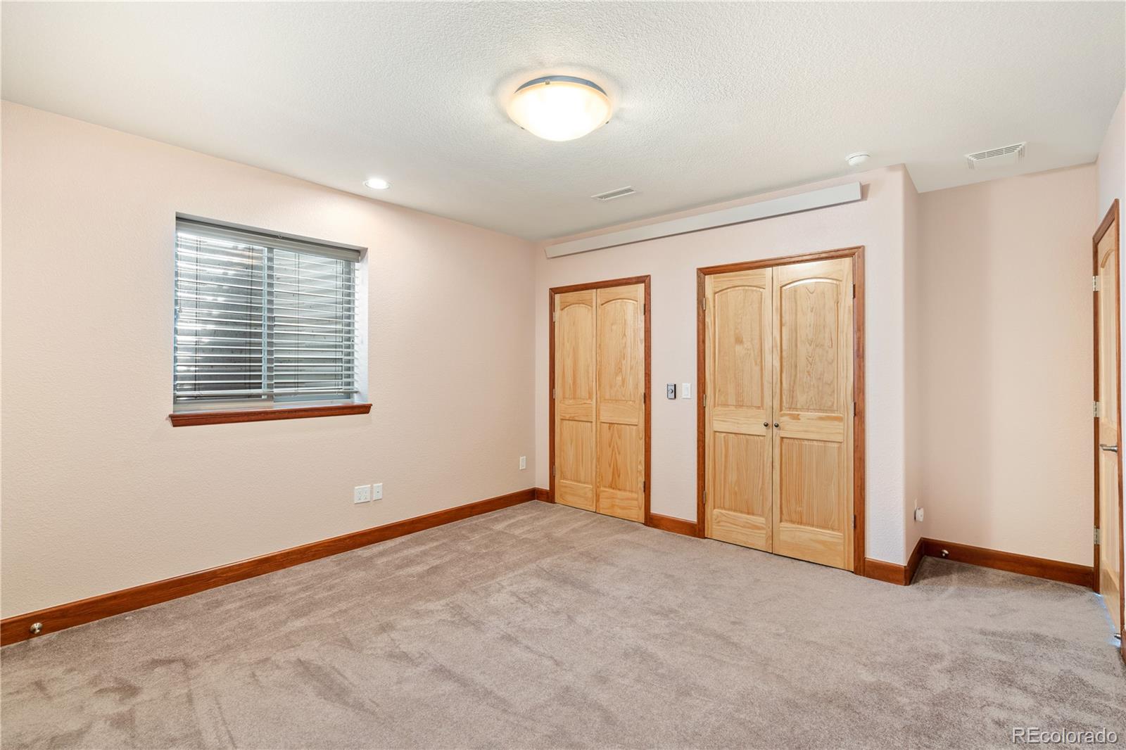17622 County Road 1 Berthoud, CO 80513 - Photo 33 of 37 an empty room with windows and closet