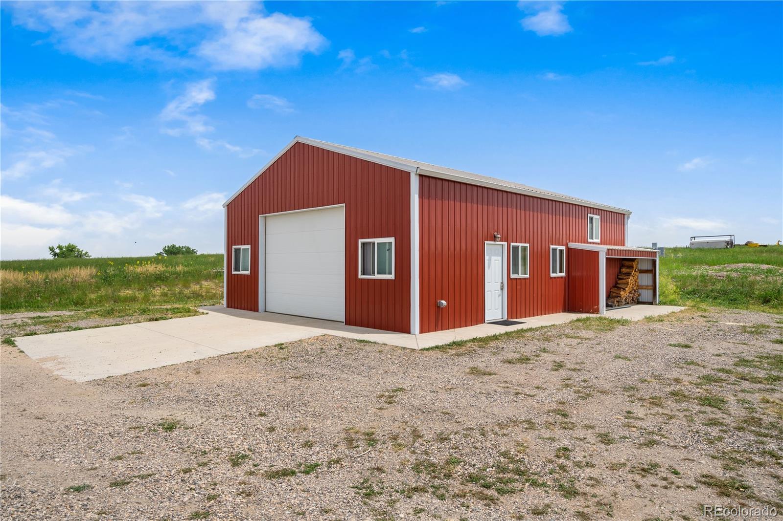 17622 County Road 1 Berthoud, CO 80513 - Photo 34 of 37 a front view of a house with a yard