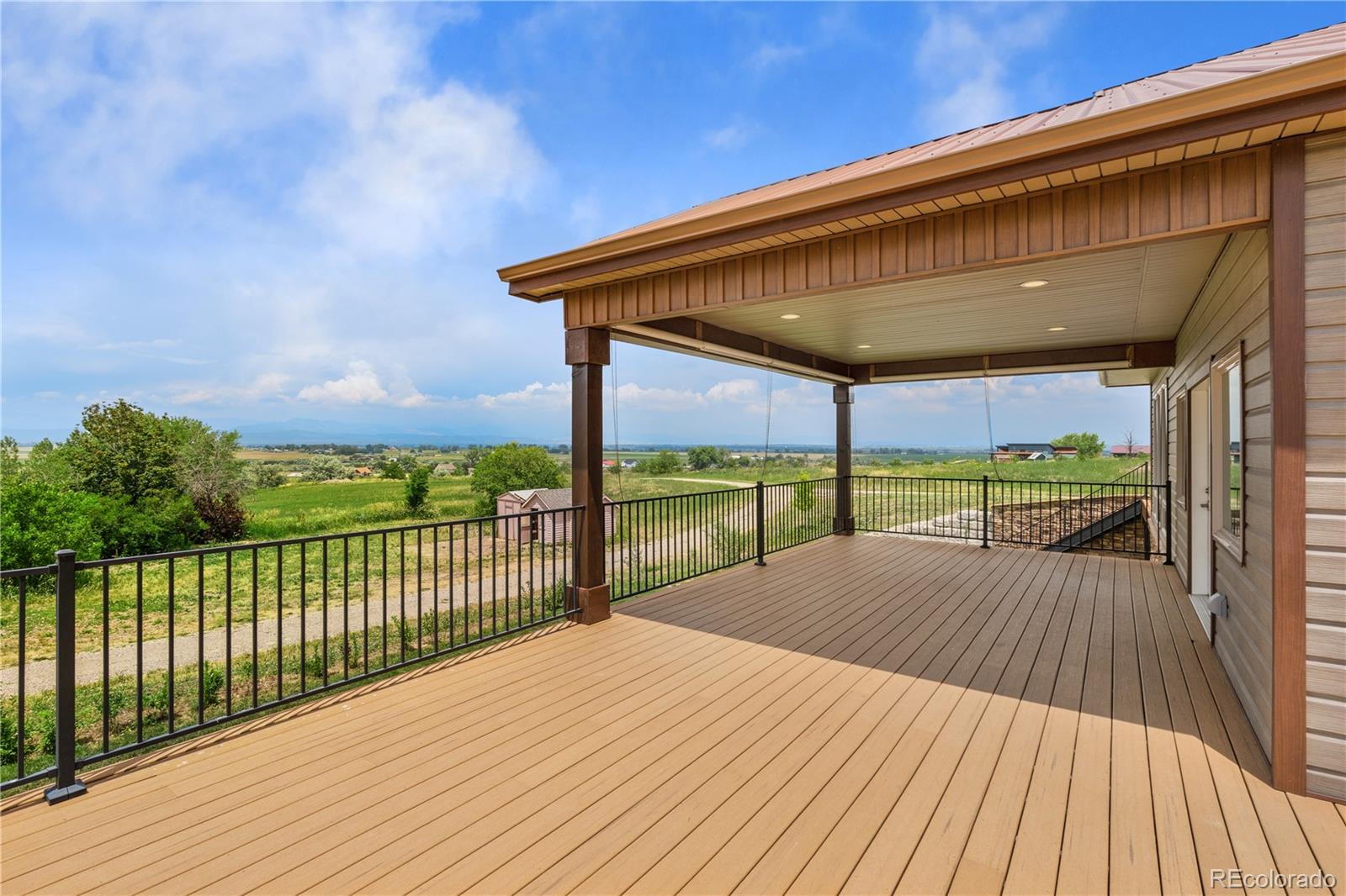 17622 County Road 1 Berthoud, CO 80513 - Photo 5 of 37 a view of balcony with wooden floor