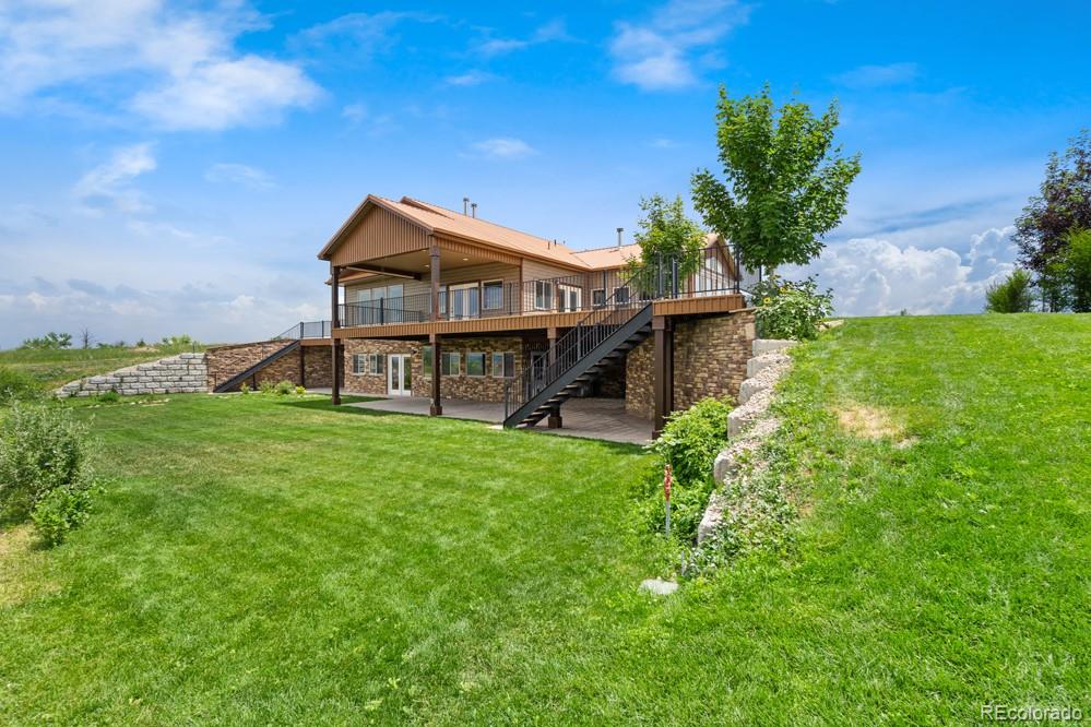 17622 County Road 1 Berthoud, CO 80513 - Photo 7 of 37 a front view of a house with garden