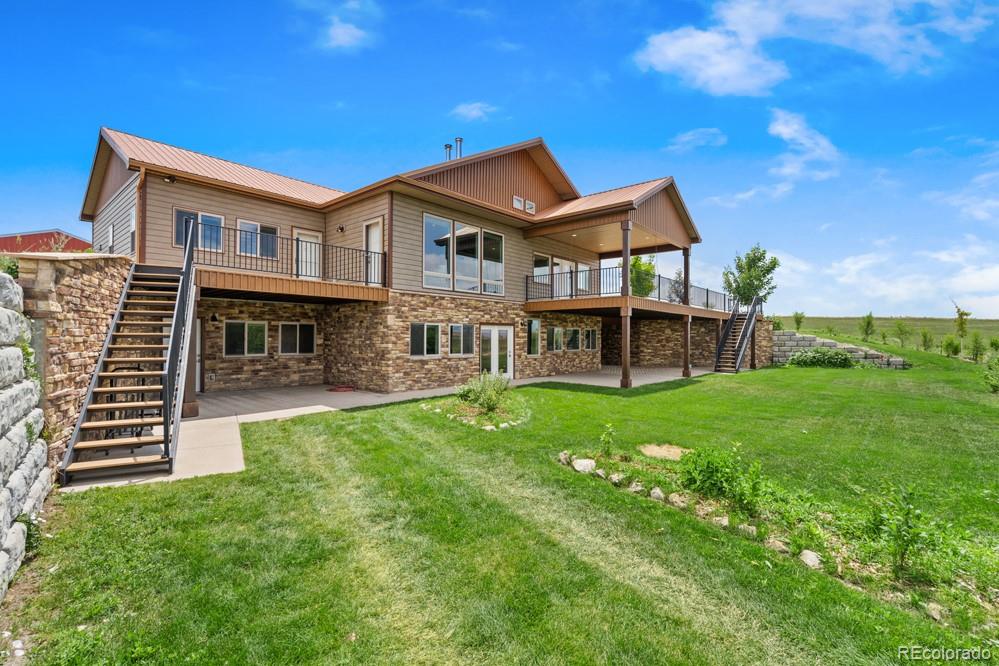 17622 County Road 1 Berthoud, CO 80513 - Photo 8 of 37 a view of a house with a backyard