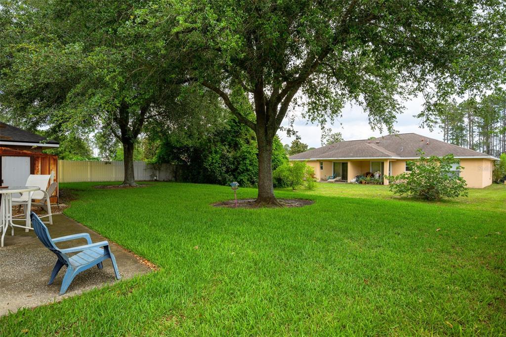 11 Riddle Drive Palm Coast, FL 32164 - Photo 21 of 33 a front view of a house with garden