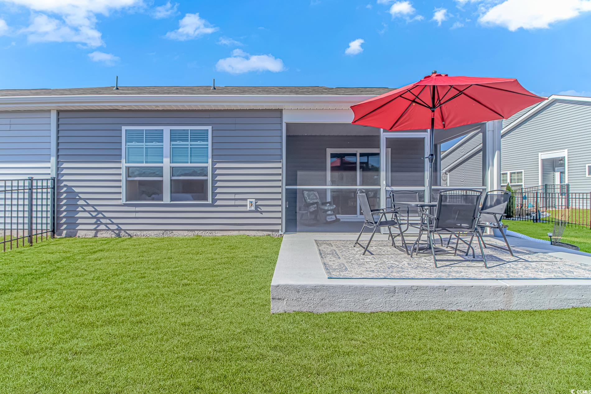 559 Courtridge Loop Conway, SC 29526 - Photo 22 of 37 Rear view of house featuring a yard and a patio