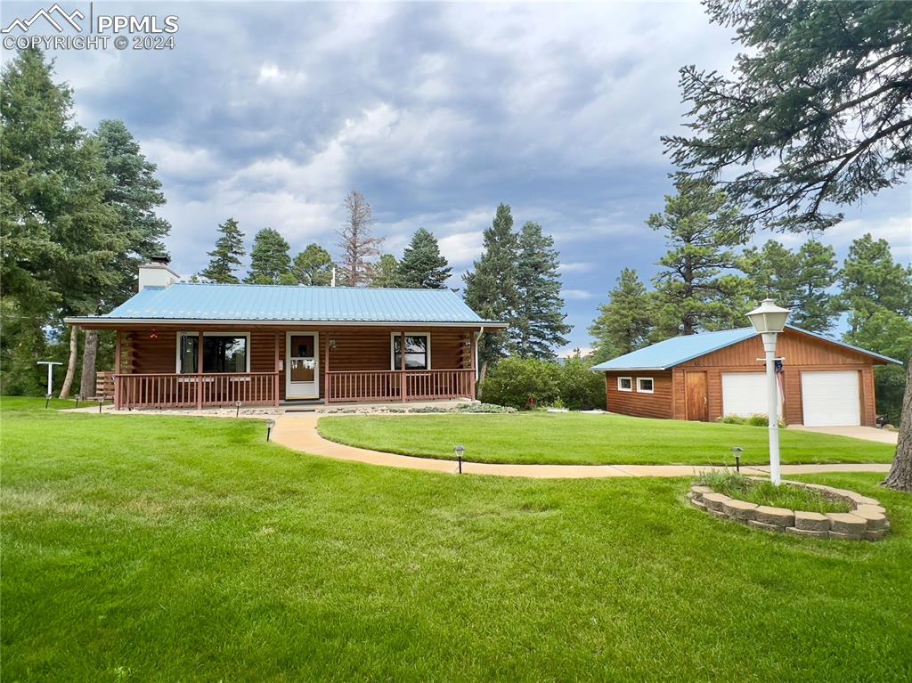 8149 Patti Drive Rye, CO 81069 - Photo 2 of 27 a view of a big house with a big yard and large trees