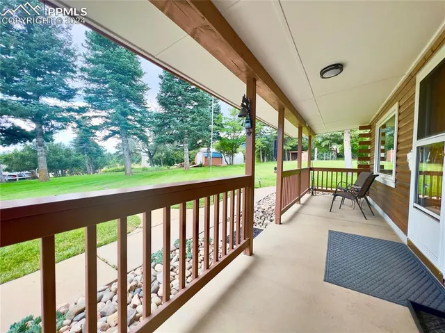 a view of balcony with couch and wooden floor
