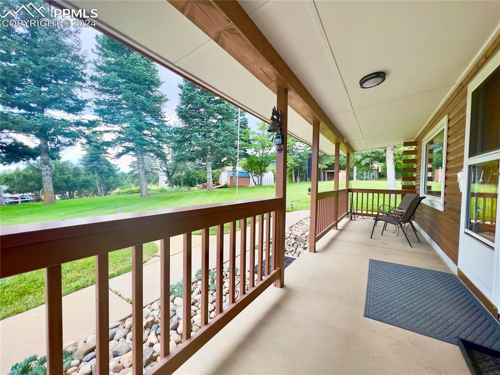 8149 Patti Drive Rye, CO 81069 - Photo 3 of 27 a view of balcony with couch and wooden floor