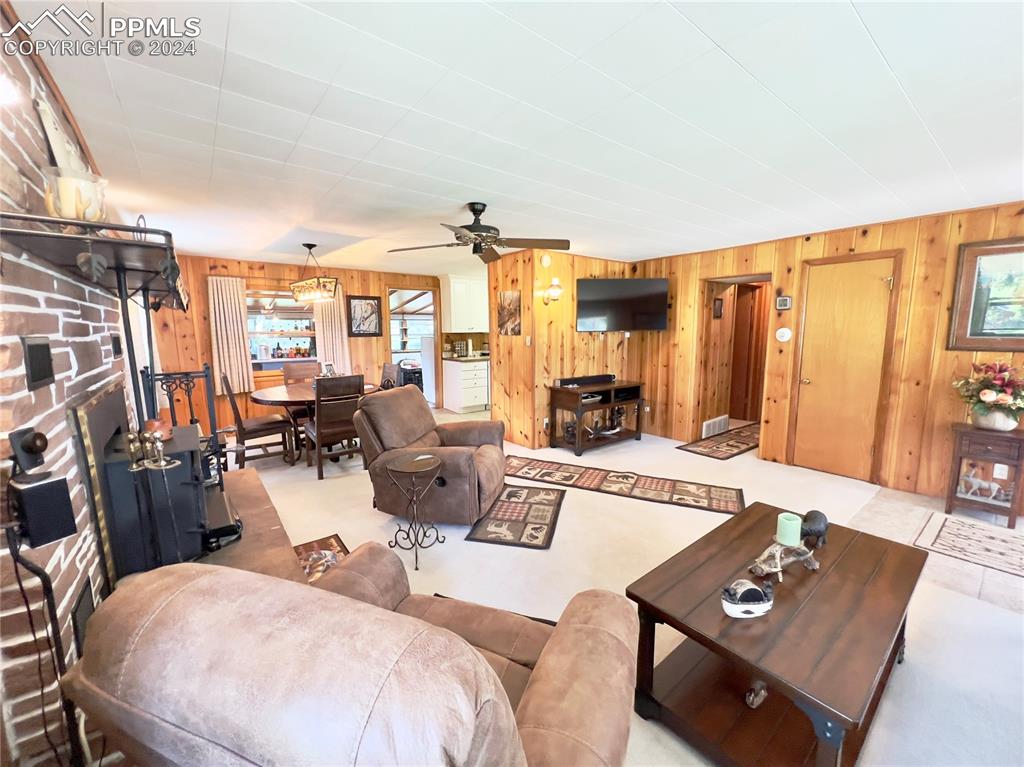 8149 Patti Drive Rye, CO 81069 - Photo 5 of 27 a living room with furniture a rug and a flat screen tv