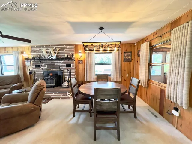 a dining room with furniture and window