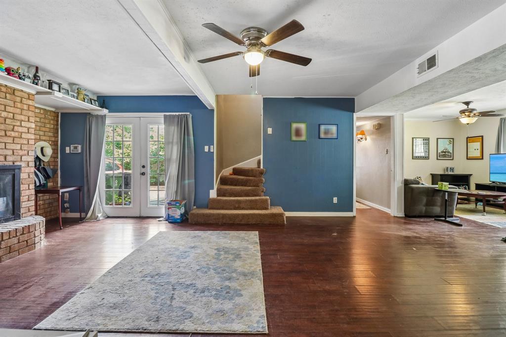 820 North Bowen Road Arlington, TX 76012 - Photo 5 of 40 a view of an entryway with wooden floor and a ceiling fan