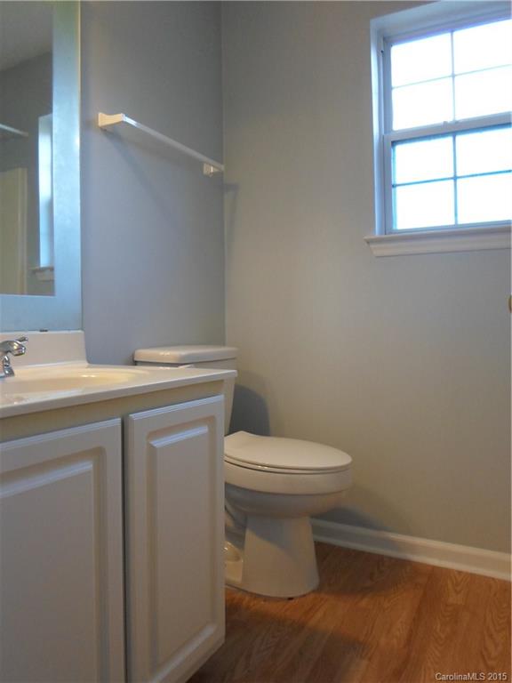 4310 Frank Vance Road Charlotte, NC 28216 - Photo 13 of 24 a bathroom with a sink a toilet and window