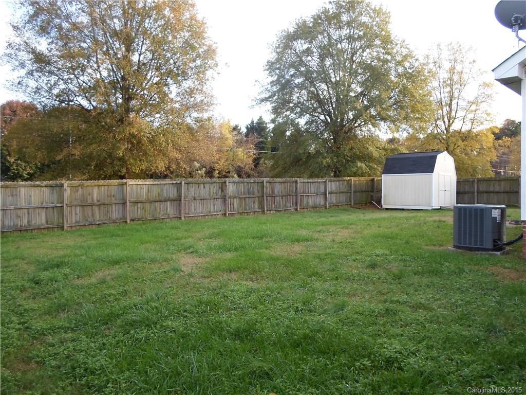4310 Frank Vance Road Charlotte, NC 28216 - Photo 21 of 24 a view of a backyard with a wooden fence