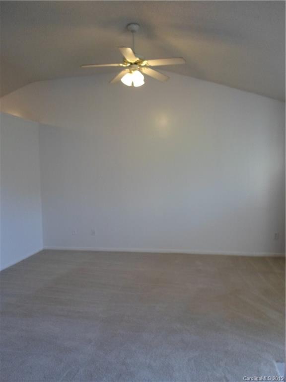 4310 Frank Vance Road Charlotte, NC 28216 - Photo 5 of 24 a view of an empty room and a chandelier fan