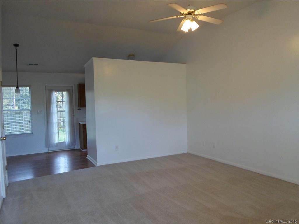 4310 Frank Vance Road Charlotte, NC 28216 - Photo 6 of 24 wooden floor in an empty room with a window