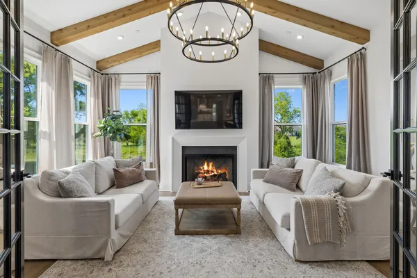 a view of a livingroom with furniture and hardwood floor