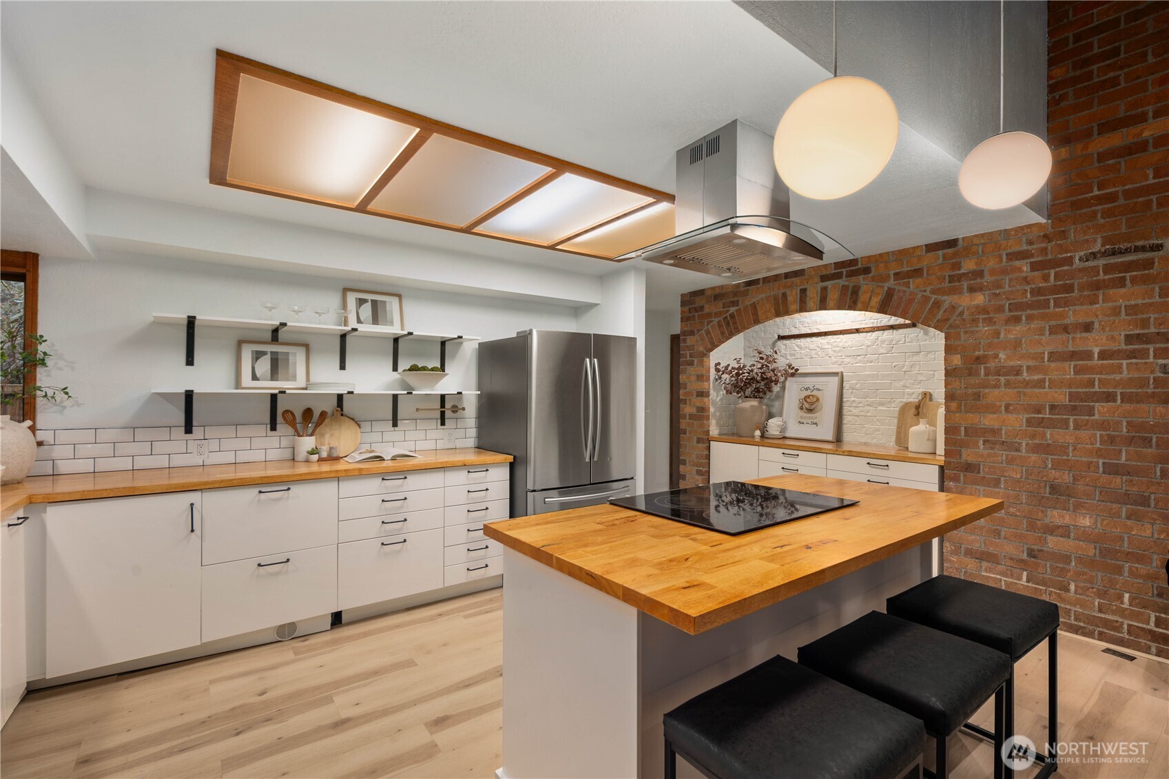 25330 215th Place Southeast Maple Valley, WA 98038 - Photo 11 of 40 a kitchen with a sink cabinets and wooden floor