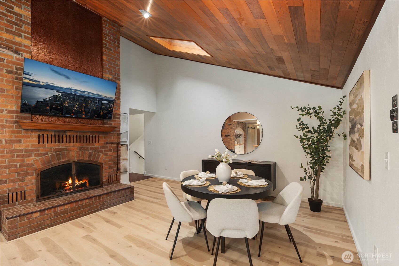 25330 215th Place Southeast Maple Valley, WA 98038 - Photo 15 of 40 a living room with furniture a fireplace and a potted plant