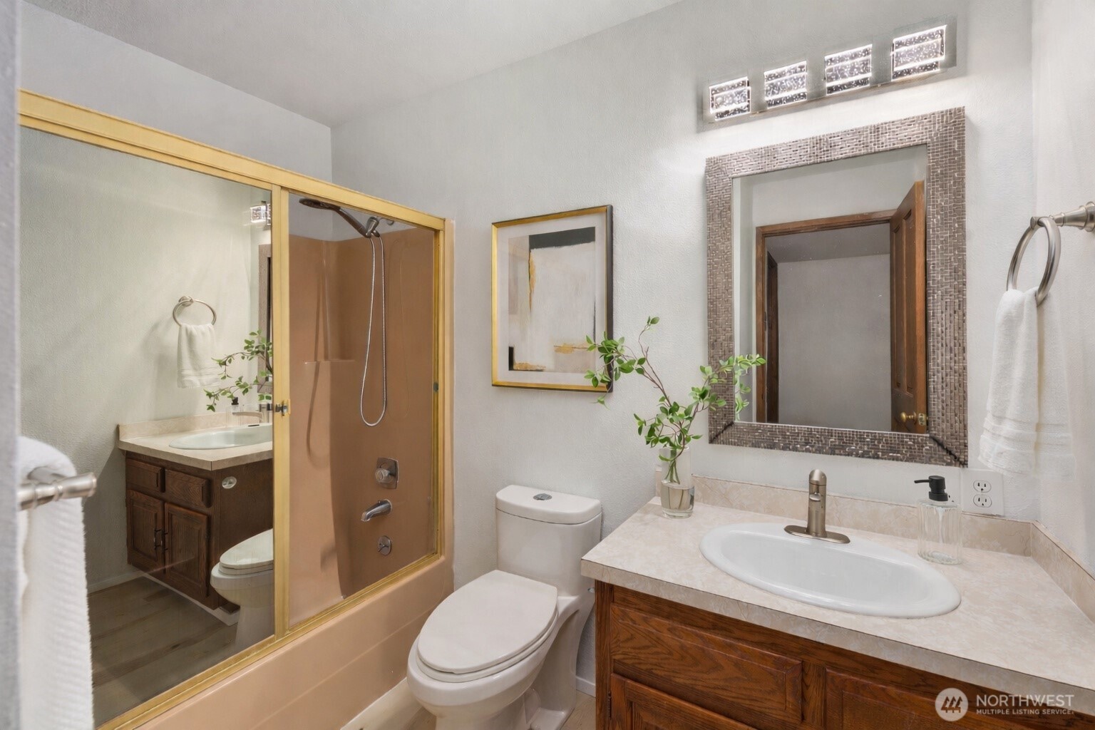 25330 215th Place Southeast Maple Valley, WA 98038 - Photo 19 of 40 a bathroom with a toilet a sink and a mirror