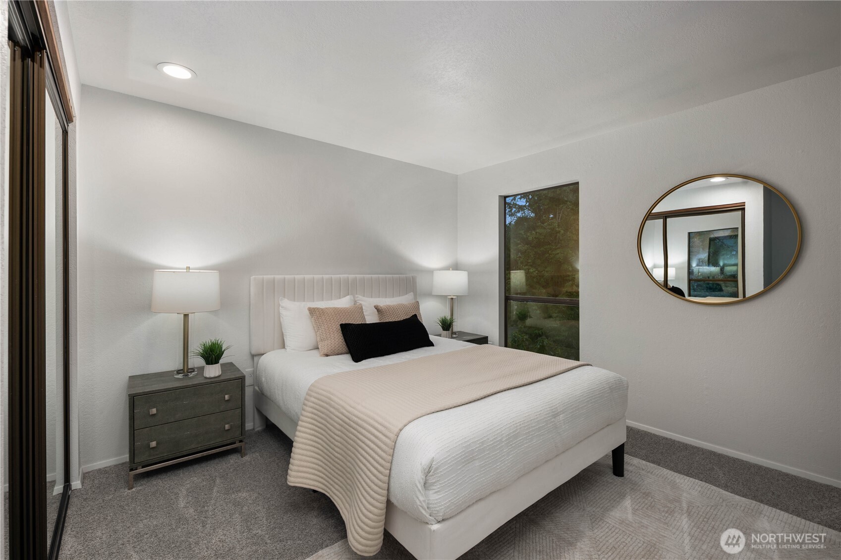 25330 215th Place Southeast Maple Valley, WA 98038 - Photo 21 of 40 a bedroom with a bed and a mirror