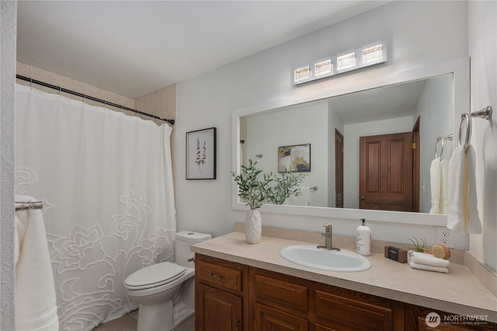 25330 215th Place Southeast Maple Valley, WA 98038 - Photo 22 of 40 a bathroom with a double vanity sink toilet and a mirror