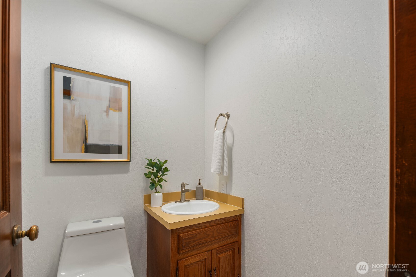 25330 215th Place Southeast Maple Valley, WA 98038 - Photo 28 of 40 a bathroom with a toilet sink and mirror