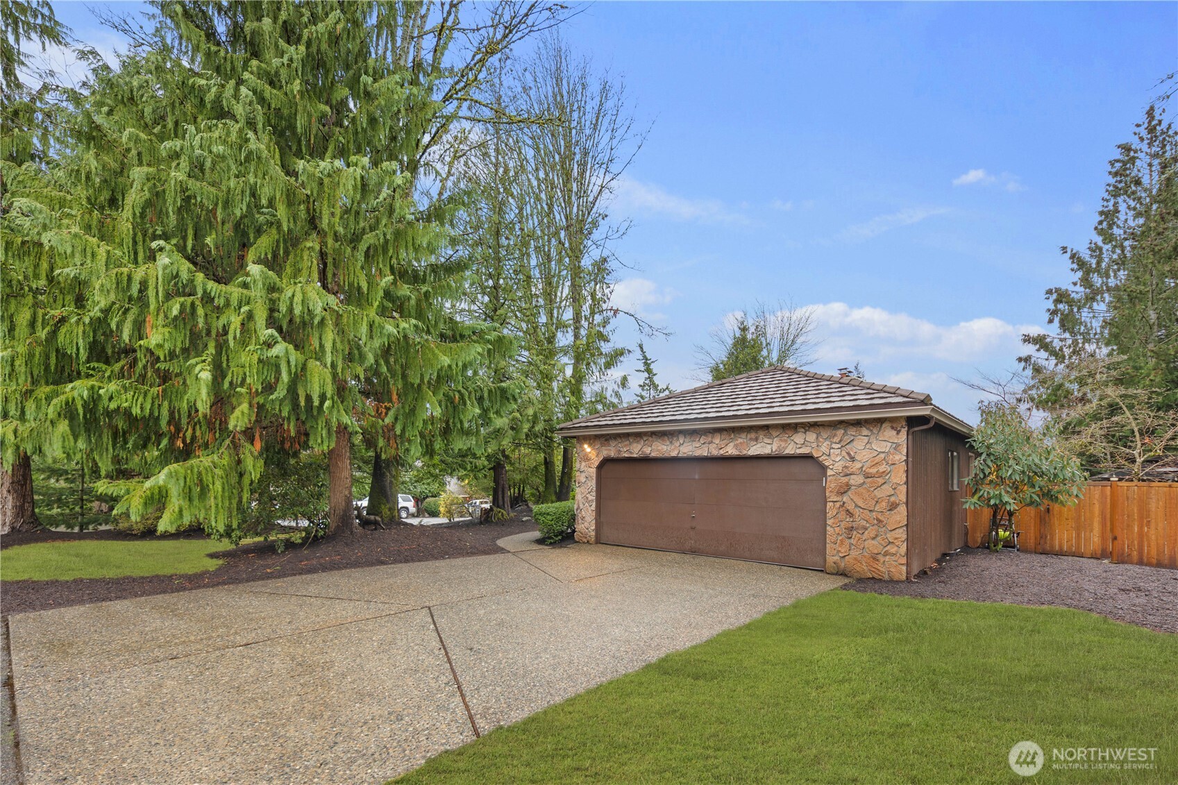 25330 215th Place Southeast Maple Valley, WA 98038 - Photo 34 of 40 a front view of a house with a garden