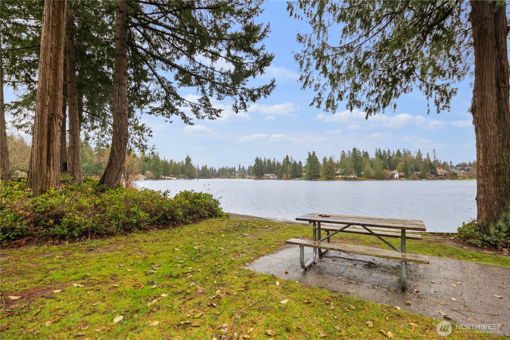 25330 215th Place Southeast Maple Valley, WA 98038 - Photo 35 of 40 a view of a lake with a bench and lake view