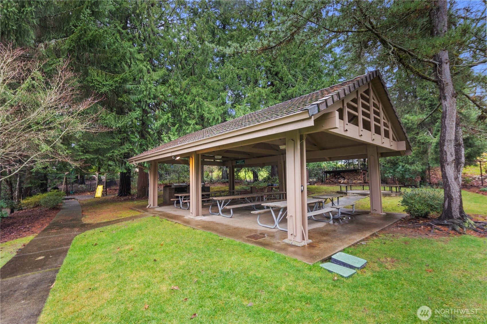 25330 215th Place Southeast Maple Valley, WA 98038 - Photo 38 of 40 a view of a chair and table in backyard of the house