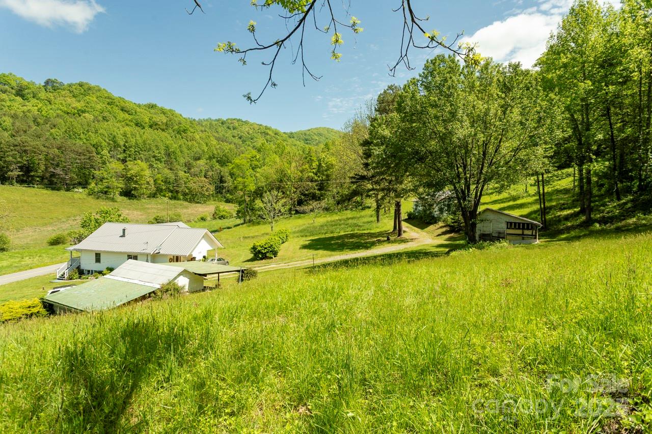 Off Of Locust Crk Road Sylva, NC 28779 - Photo 5 of 20 a backyard of a house with a yard and outdoor seating