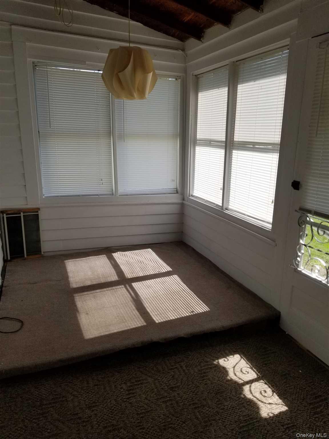 24 Lagrange Avenue Poughkeepsie, NY 12603 - Photo 8 of 10 Back Porch/Sunroom leads to large fenced in back yard