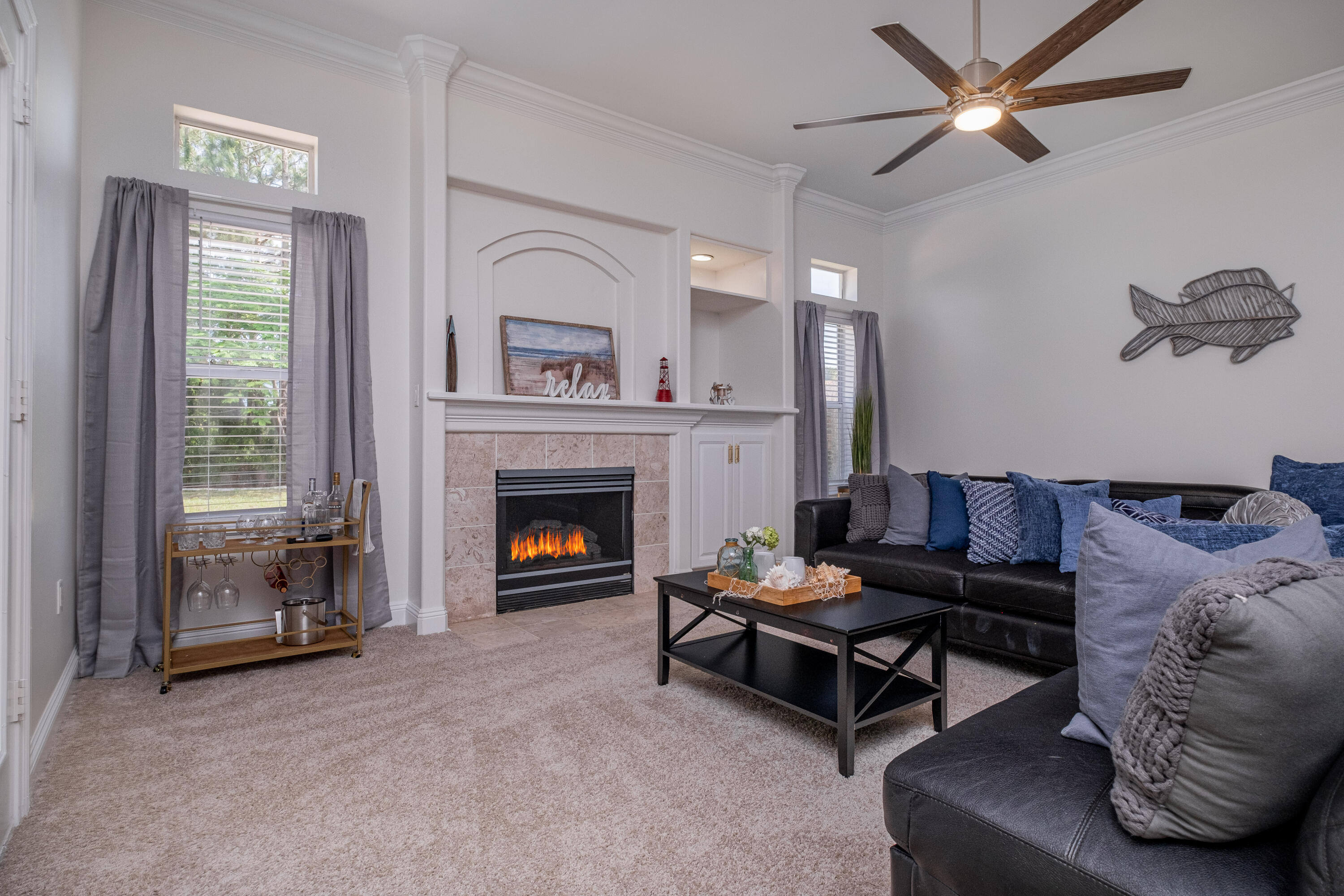 38 Kristin Cove Destin, FL 32541 - Photo 18 of 57 a living room with furniture and a fireplace