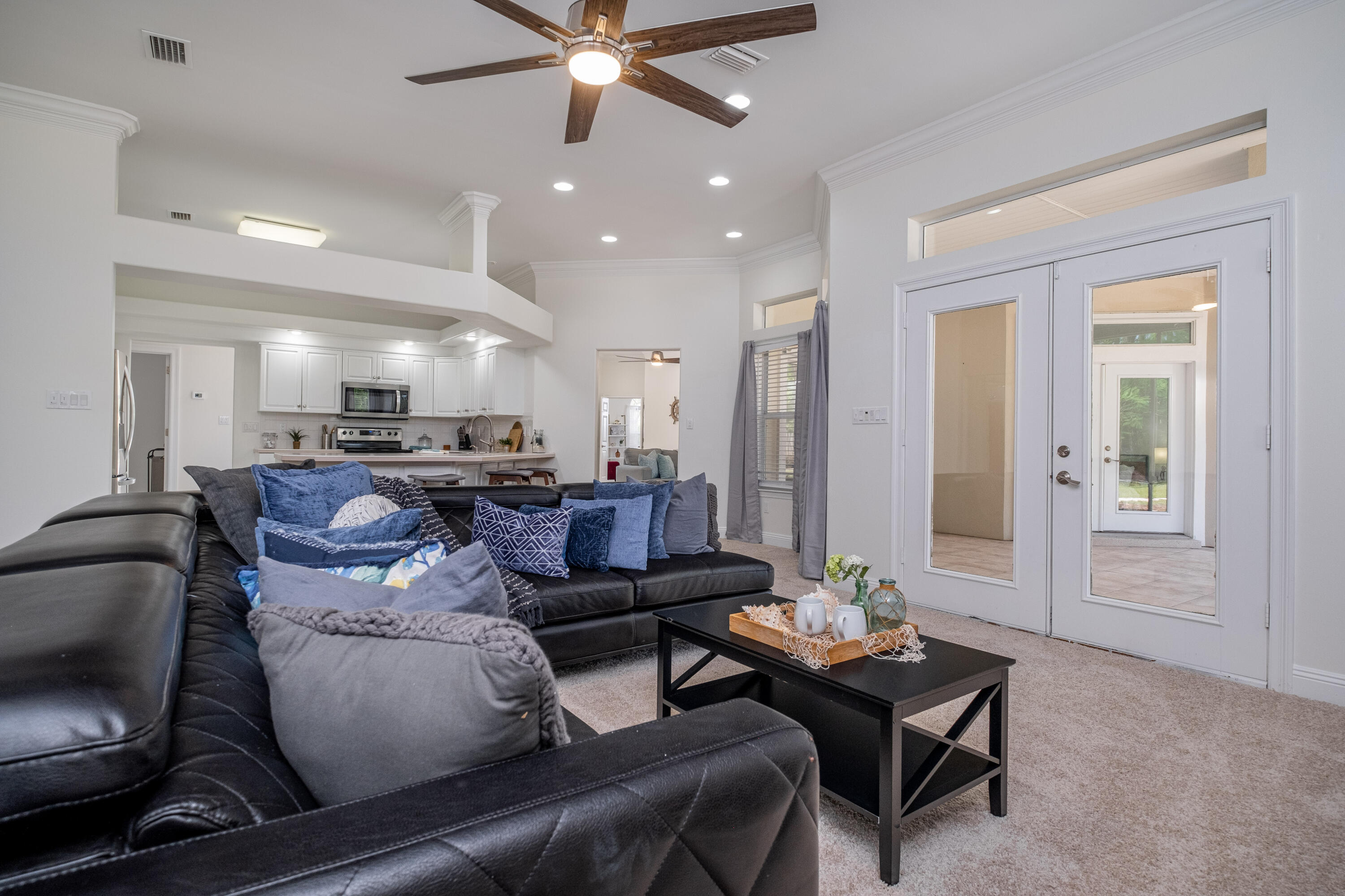 38 Kristin Cove Destin, FL 32541 - Photo 20 of 57 a living room with furniture and a chandelier