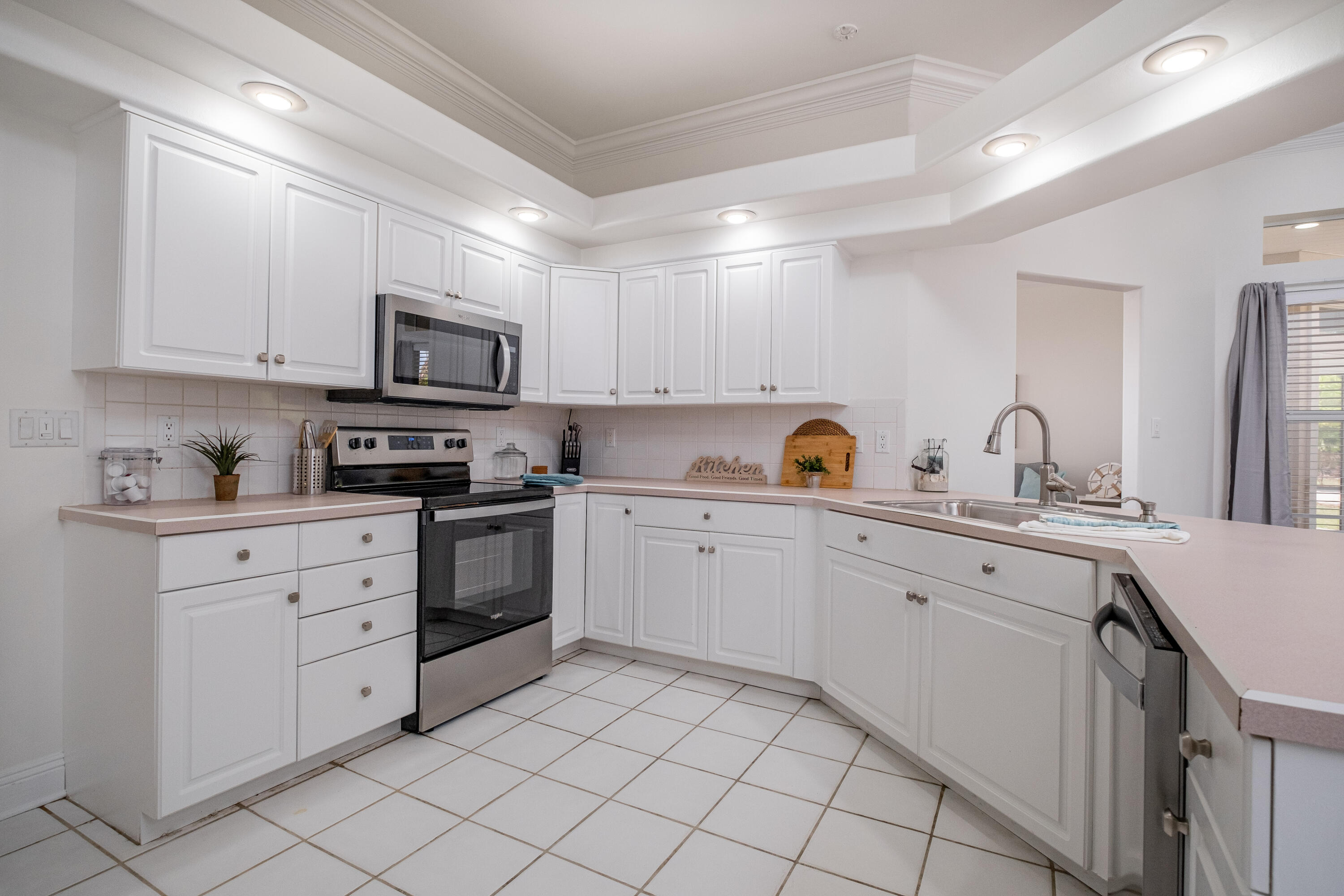 38 Kristin Cove Destin, FL 32541 - Photo 24 of 57 a kitchen with cabinets appliances a sink and a counter top space