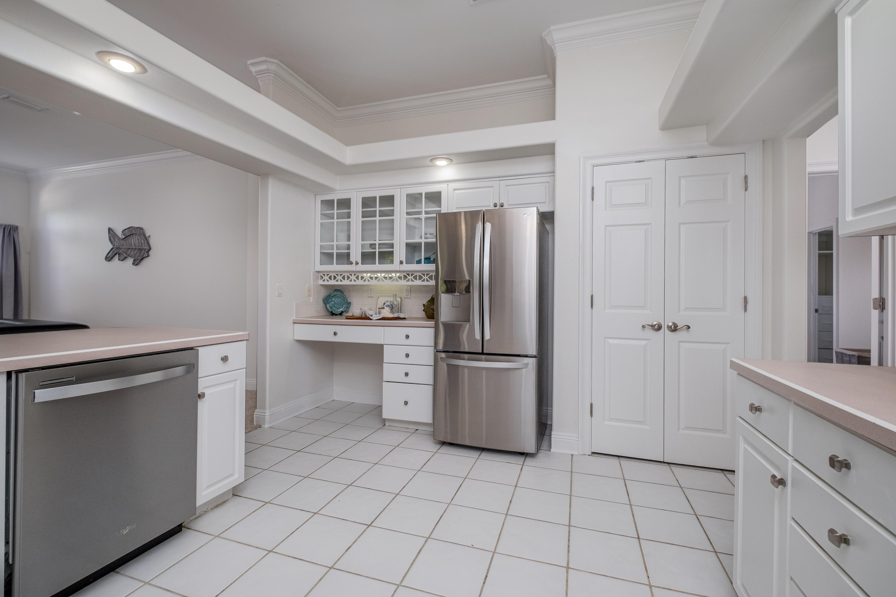 38 Kristin Cove Destin, FL 32541 - Photo 27 of 57 a kitchen with white cabinets and stainless steel appliances
