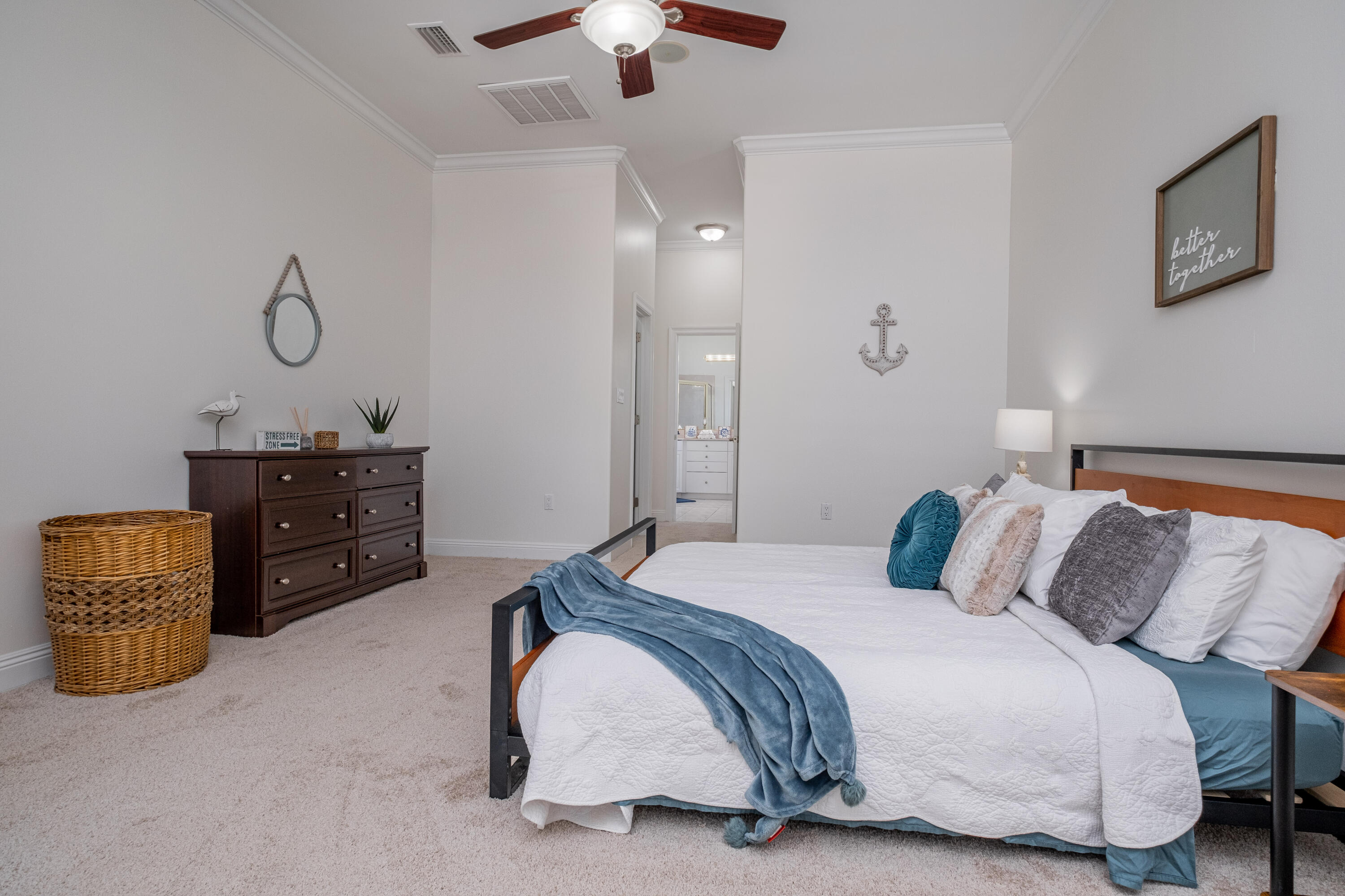 38 Kristin Cove Destin, FL 32541 - Photo 30 of 57 a bedroom with a bed and a chandelier