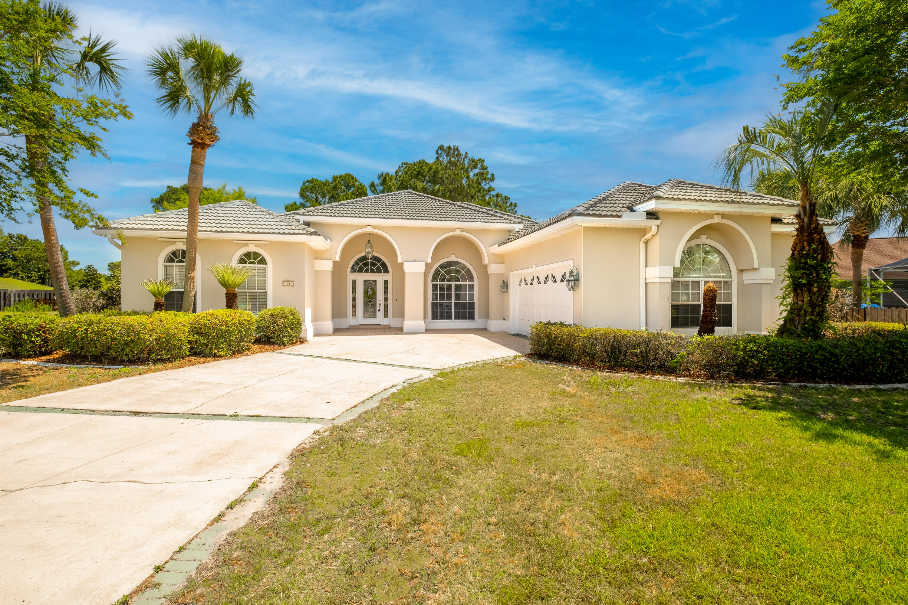 38 Kristin Cove Destin, FL 32541 - Photo 4 of 57 a front view of a house with a yard