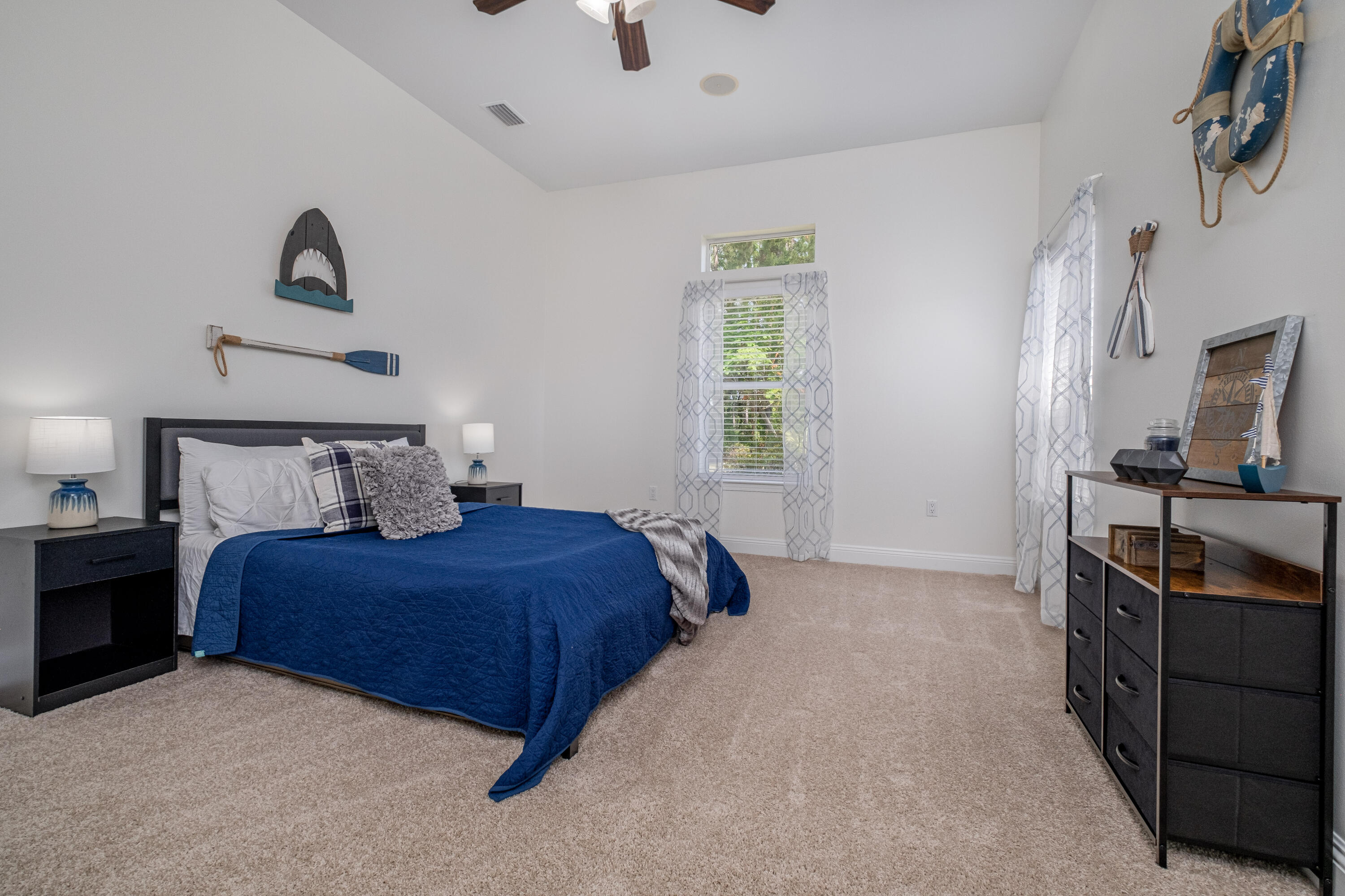 38 Kristin Cove Destin, FL 32541 - Photo 41 of 57 a bedroom with a bed and a flat tv screen on the dresser