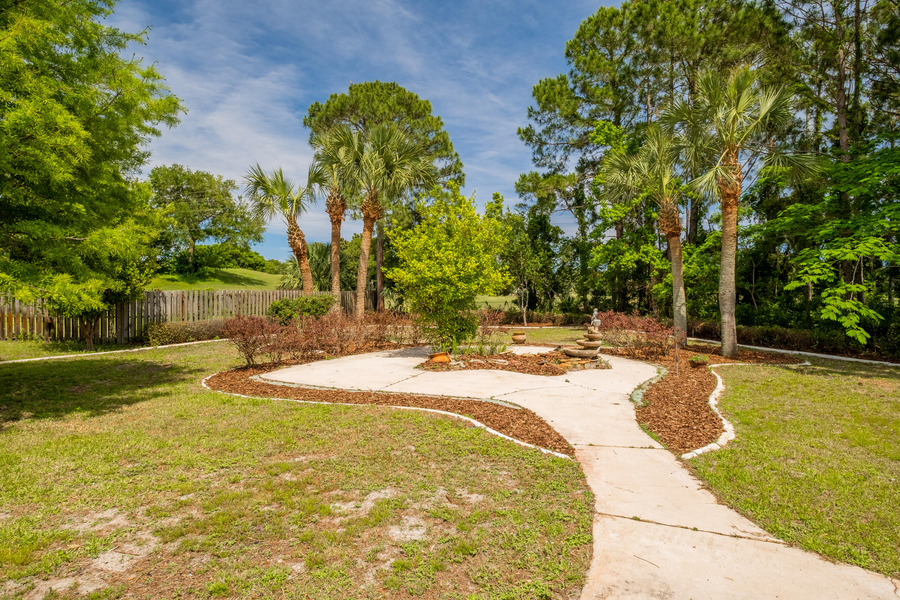38 Kristin Cove Destin, FL 32541 - Photo 48 of 57 a swimming pool with trees in the background