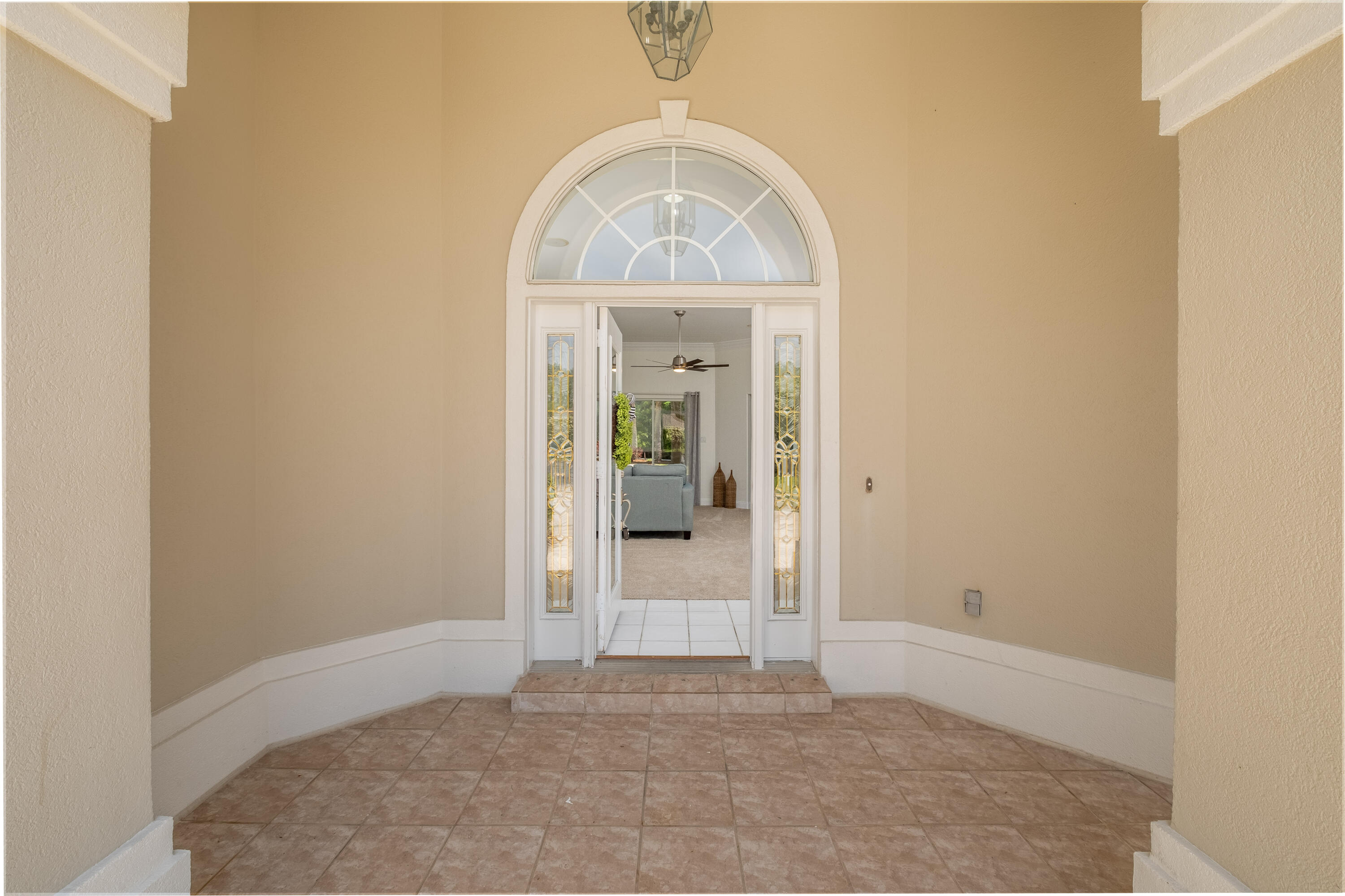 38 Kristin Cove Destin, FL 32541 - Photo 5 of 57 an empty room with wooden floor cabinet and a bathroom