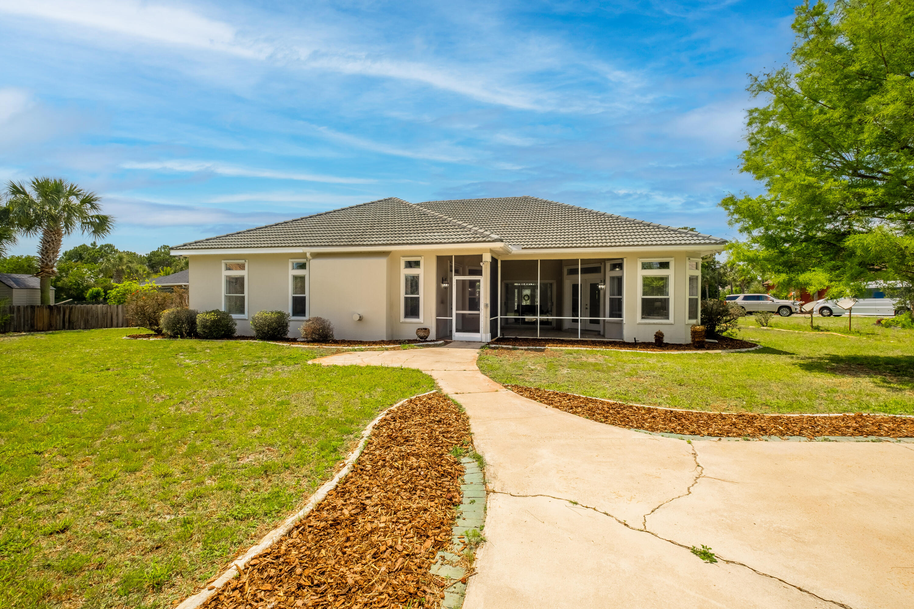 38 Kristin Cove Destin, FL 32541 - Photo 52 of 57 a view of a house with swimming pool and a yard