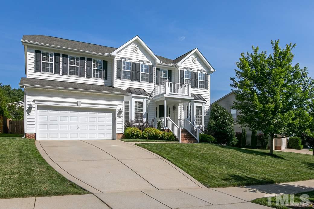 108 Quarryrock Road Holly Springs, NC 27540 - Photo 2 of 30 a front view of a house with a yard and trees