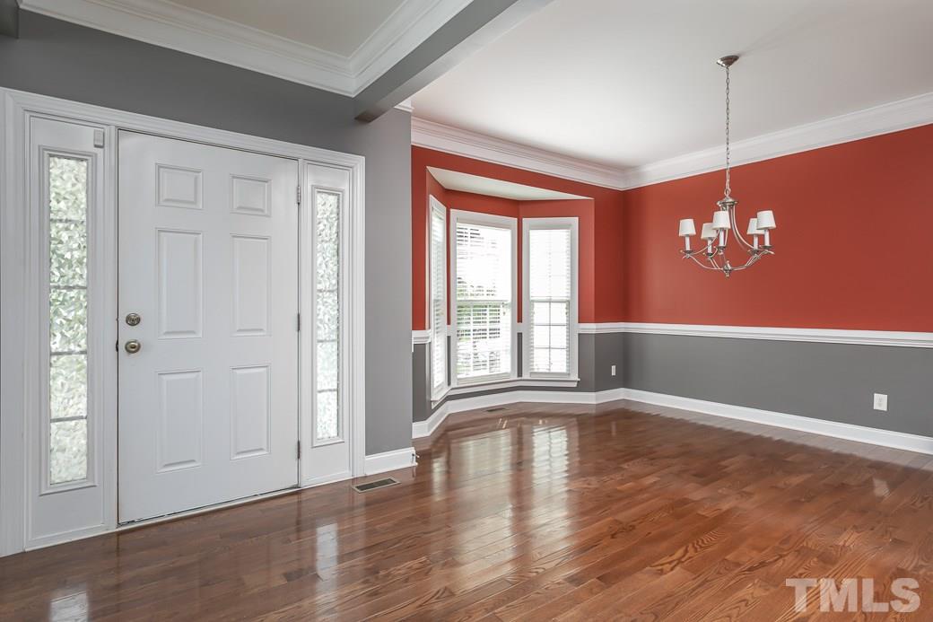 108 Quarryrock Road Holly Springs, NC 27540 - Photo 15 of 30 a view of empty room with wooden floor and fan