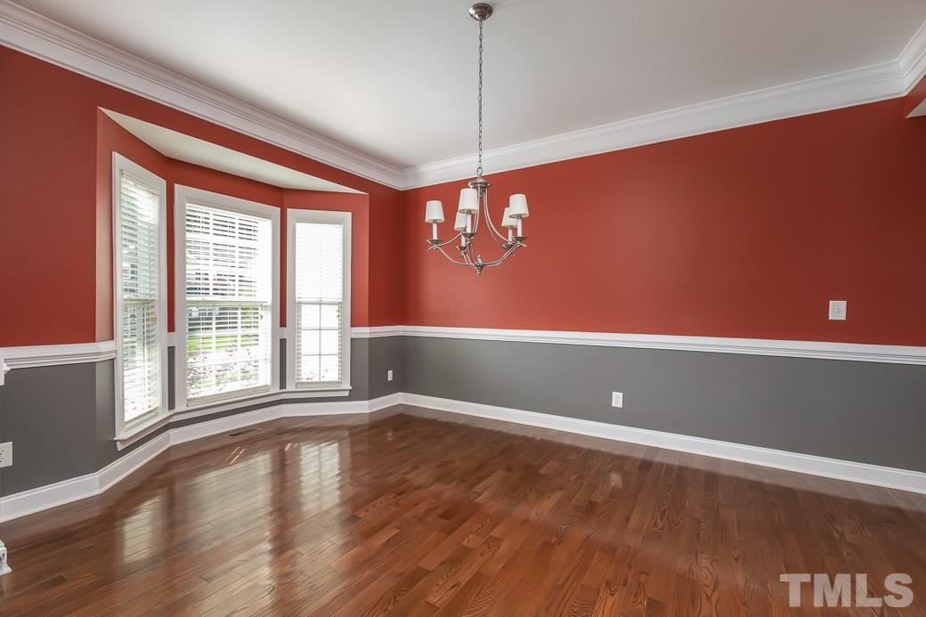 108 Quarryrock Road Holly Springs, NC 27540 - Photo 16 of 30 a view of empty room with wooden floor and fan