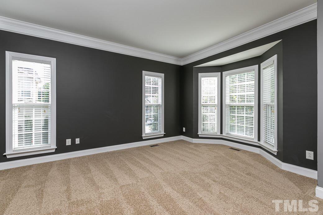 108 Quarryrock Road Holly Springs, NC 27540 - Photo 17 of 30 a view of an empty room with a window