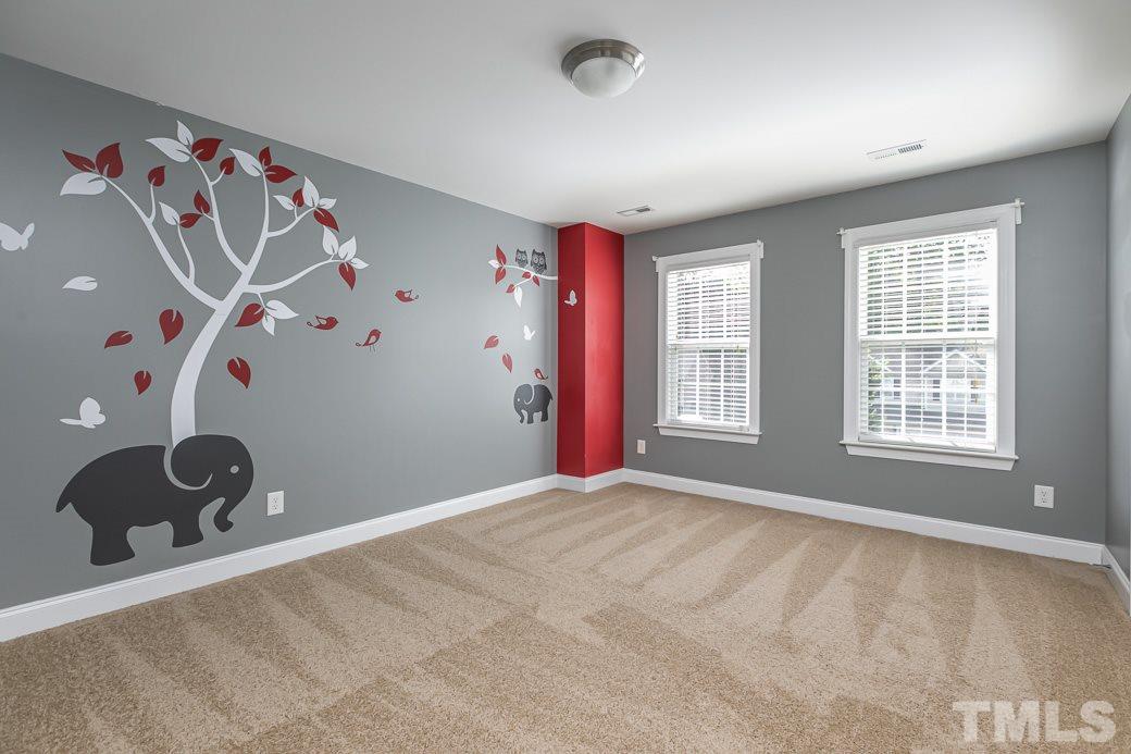 108 Quarryrock Road Holly Springs, NC 27540 - Photo 19 of 30 an empty room with windows and cabinet