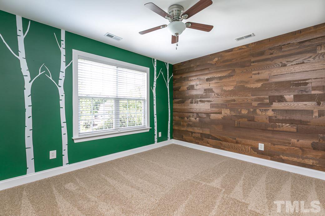 108 Quarryrock Road Holly Springs, NC 27540 - Photo 20 of 30 a view of an empty room with a window