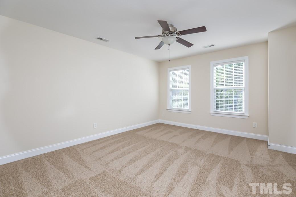 108 Quarryrock Road Holly Springs, NC 27540 - Photo 21 of 30 a view of an empty room with a window