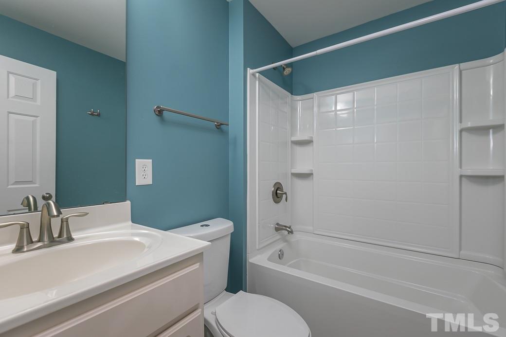 108 Quarryrock Road Holly Springs, NC 27540 - Photo 23 of 30 a bathroom with a sink toilet and shower