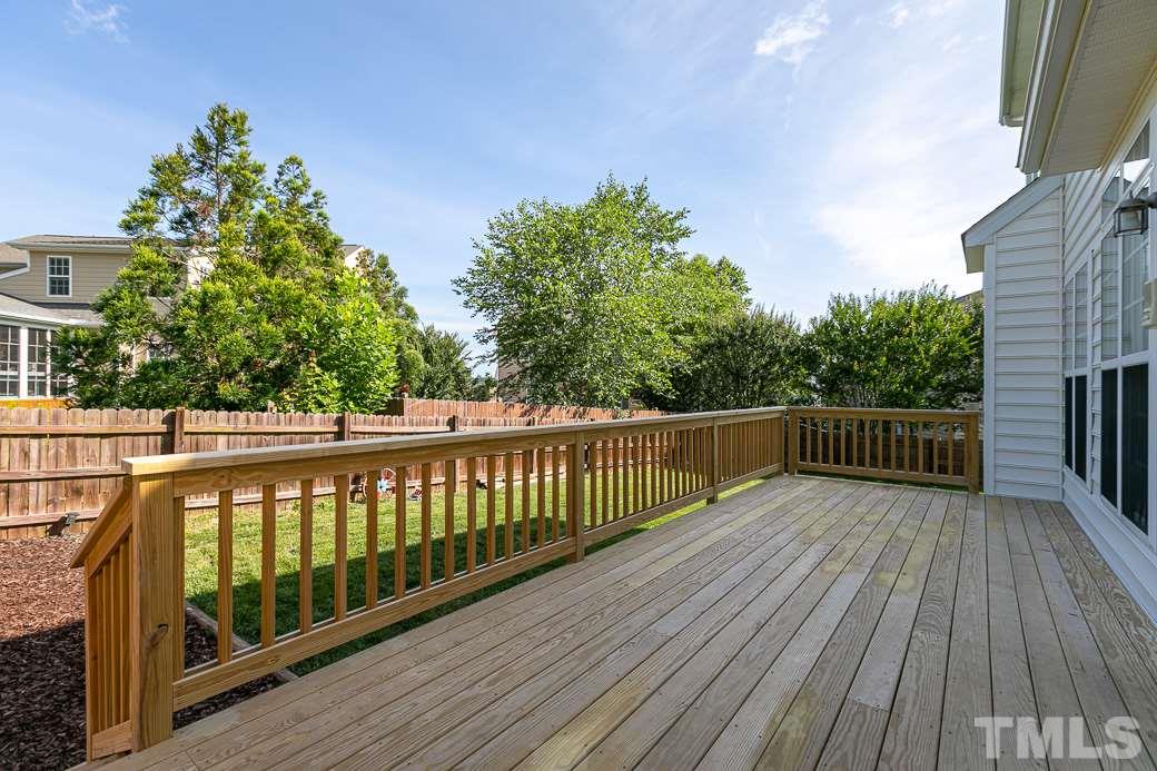 108 Quarryrock Road Holly Springs, NC 27540 - Photo 24 of 30 a balcony with wooden floor and fence
